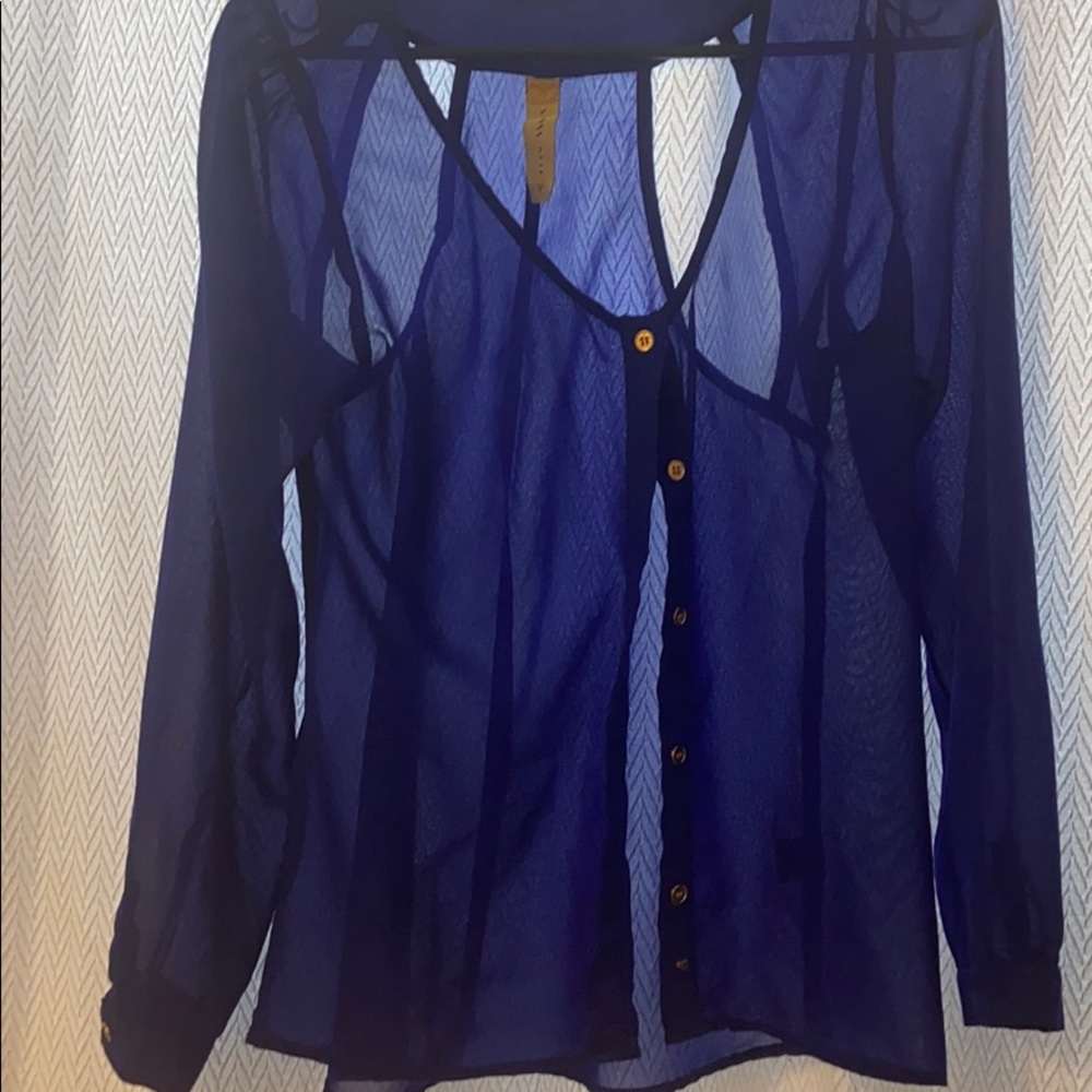 Bright blue blouse with cut out back detailing